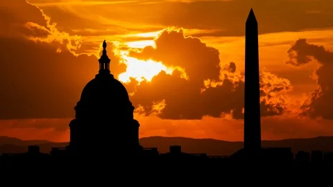 Iconic Monuments in Washington, Sunset with Red Sun and Fiery Clouds, USA Stock Footage 122750654