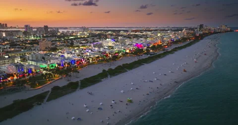 Iconic palm lined Ocean Drive at night in Miami Beach. A must visit Florida Stock Footage 311750979