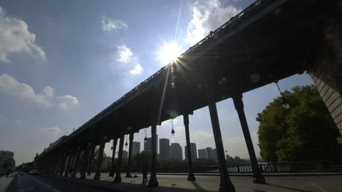 Iconic Paris metro line, sun flare, overground Seine mass transit bridge Stock Footage 70179182