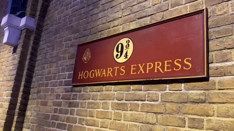 The iconic Platform 9 ¾ sign mounted on the brick wall at the Leavesden studio Stock Footage 324819666