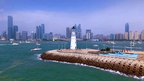 Iconic Qingdao Lighthouse, Olympic Sailing Center &amp; Cityscape Stock Footage 330848807