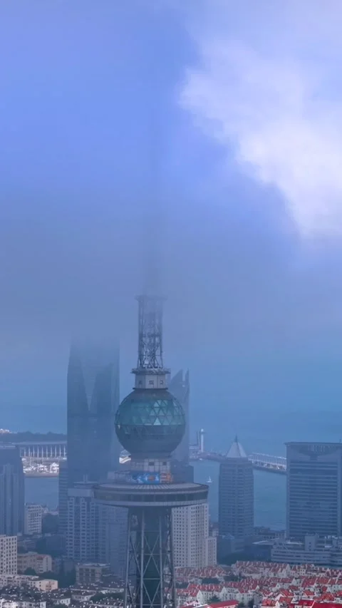 Iconic Qingdao TV Tower Amidst Misty Urban Skyline Stock Footage 330732995