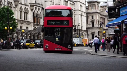 Iconic red double decker buses &amp;amp; black taxi in business district London, UK. Video stock 116681417