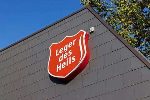 The iconic red shield logo of the Leger des Heils (Salvation Army) on the sid Stock Photos