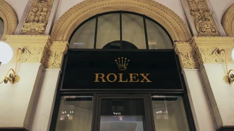 Iconic Rolex Storefront in Milan's Prestigious Galleria Vittorio Emanuele II Stock Footage 337578835