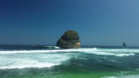 Iconic Sea Stack Ocean Waves 4K Aerial Malang East Java Coast 스톡 동영상 343685457