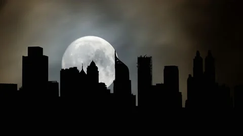 Iconic Skyline of Jakarta, Time Lapse by Night with Full Moon, Indonesia Stock Footage 220096900