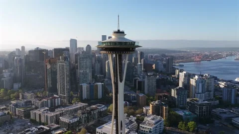 Iconic Space Needle stands tall at sunrise, overlooking Seattle downtown 스톡 동영상 334605446
