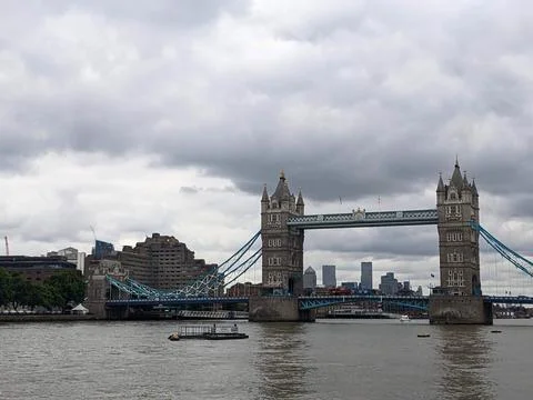 Iconic Tower Bridge over the River Thames with the London skyline under a Stock Photos