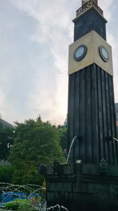 Iconic UB Clock Tower Fountain: Malang Campus Landmark Stock Footage 312194788