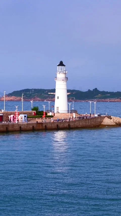 Iconic White Lighthouse at Qingdao Olympic Sailing Center, China Stock Footage 330848983