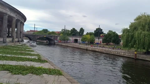 Iconic yellow U-Bahn train crossing a bridge over The Spree River in Berlin Stock Footage 343153081