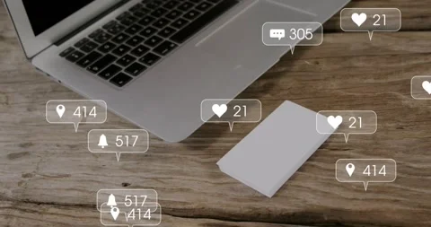 Icons materializing at sec two, rising, falling around laptop and device showing Stock Footage 318499184