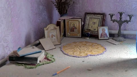Icons standing on the table in the house where the Russian shell flew in Stock Footage 196875894