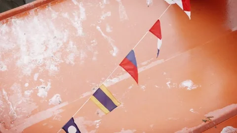 ICS flags on a boat blowing in the wind slow motion stock footage Stock Footage 314564504