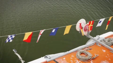 ICS flags on a boat blowing in the wind slow motion stock footage Stock-Footage 314726966