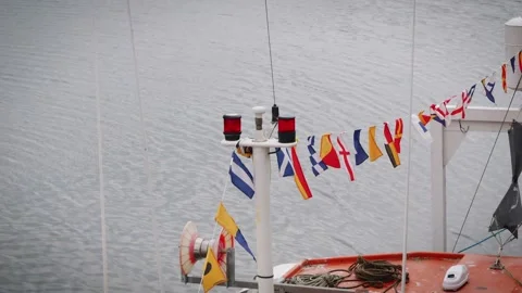 ICS flags on a boat blowing in the wind slow motion stock footage Stock-Footage 314727165