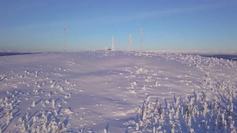 Icy cellular base station antenna covered with snow. Cell site tower on moutain Stock-Footage 148748764