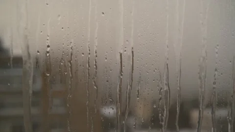 Icy icicles forming on a window Stock Footage 325689487