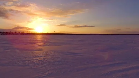 An icy lake at sunset Video stock 88484096