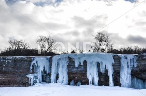 Icy limestone cliffs at the coast of the swedish island öland in the baltic Stock Photos