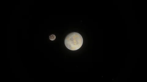 Icy moon orbits Earth like planet in outer space Stock Footage 116786773