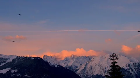 Icy mountains with cloudy winter sky panorama during sunset Stock Footage 121576648