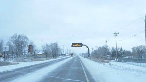 Icy Roads Use Caution Highway Sign Stock Footage 104998787