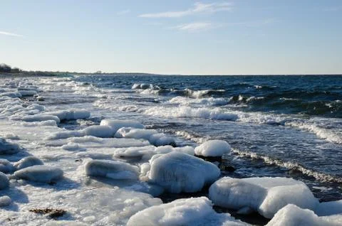 Icy rocks by the coast Stock Photos