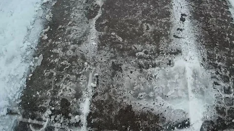 Icy sidewalk follow Stock Footage 124018154