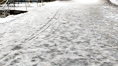 Icy sidewalk slippery surface winter safety and deicing Stock Footage 320832364
