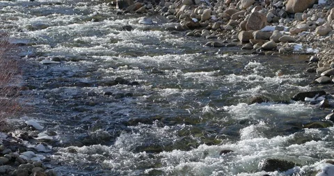 Icy Water Flows Down Lake Creek, Colorado, 4K Stock Footage 121891670