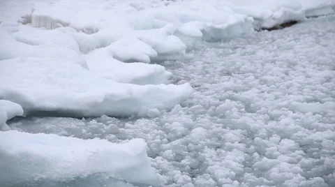 Icy waves rolling up on shore Stock Footage 35543211
