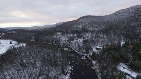 Icy winter river through dense pines Stock Footage 321178922