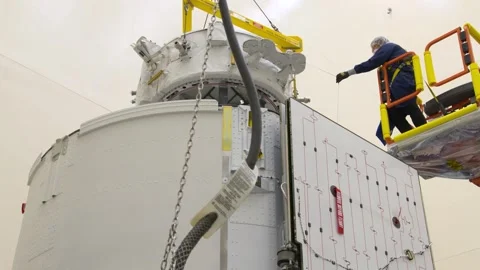 IDA-3 being installated into the trunk of SpaceX Dragon spacecraft Stock Footage 289728863