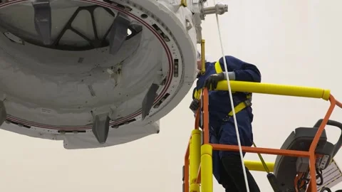 IDA-3 being positioned during installation into trunk SpaceX Dragon spacecraft Stock Footage 289728868