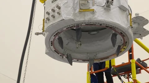 IDA-3 being positioned for installation into trunk SpaceX Dragon spacecraft Stock Footage 289728864
