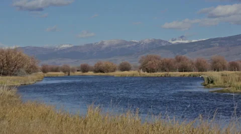 Idaho river with mountains in background Stock Footage 36314079