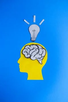 Idea and Creativity Concept with Brain, Head, and Lightbulb Stock Photos