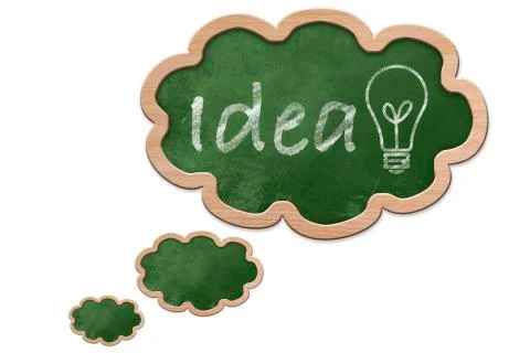 Idea and a light bulb on a thought bubble shaped blackboard Stock Illustration