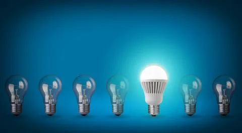 Idea concept on blue background. row with light bulbs and led bulb. Stock Photos