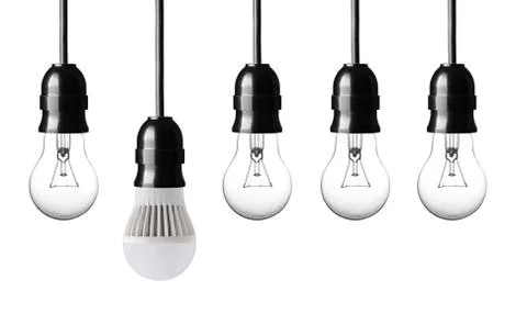 Idea concept with bulbs on white background Stock Photos