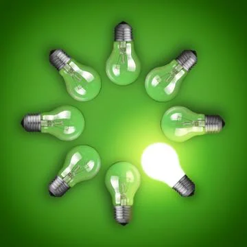 Idea concept with circle of light bulbs and glowing bulb Stock Photos
