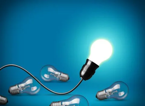 Idea concept with glowing light bulb Stock Photos