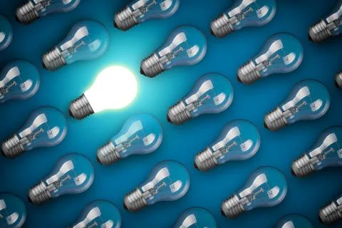 Idea concept with light bulbs on blue background Stockfoto's