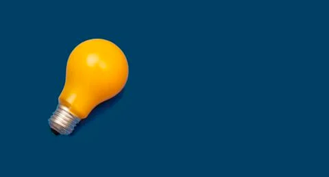 Idea concept with light bulbs on a blue background with copy space for your t Stock Photos