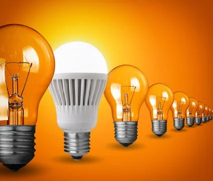 Idea concept with light bulbs on orange background Stock Photos