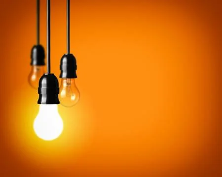 Idea concept on orange background. Stock Photos