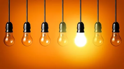 Idea concept on orange background. Stock Photos