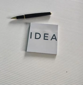 Idea Concept with Pen and Note in Minimal Workspace Stock Photos